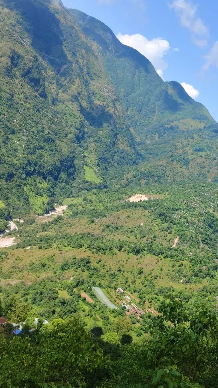 Forested hills and terraces falling away to the Kaligandaki valley